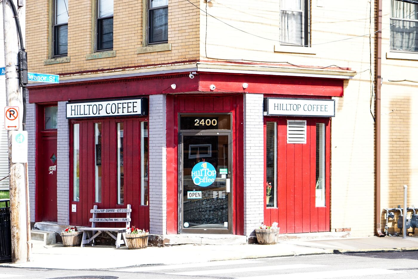 The red Hilltop Coffee storefront at 2400 Arlington Ave